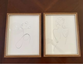 Set of two framed sketches of women.
