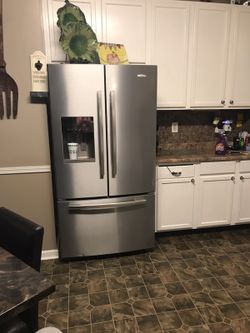 Whirlpool refrigerator Frigidaire electric stove and Samsung microwave
