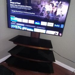 Flat screen TV, with glass stand