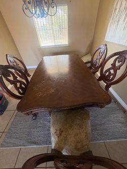 Table and chairs with two extended pieces