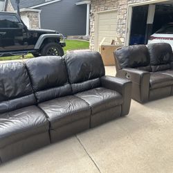 Dark brown, leather reclining, couch, and reclining loveseat.