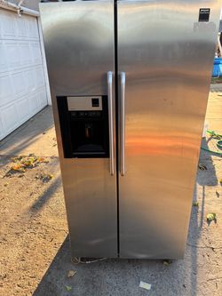Black side by side fridge for sale.