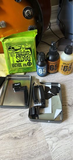 Guitar and Guitar Maintenance Kit with Strings and Cleaners