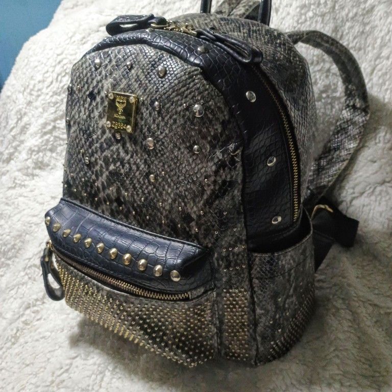 MCM Genuine Snakeskin Armor Studded Backpack Size Medium. Brand New