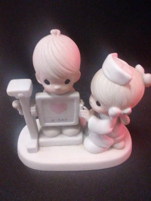 Various Precious Moments figurines.