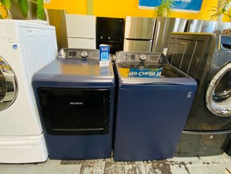 Lavadora y secadora azul a Pagos