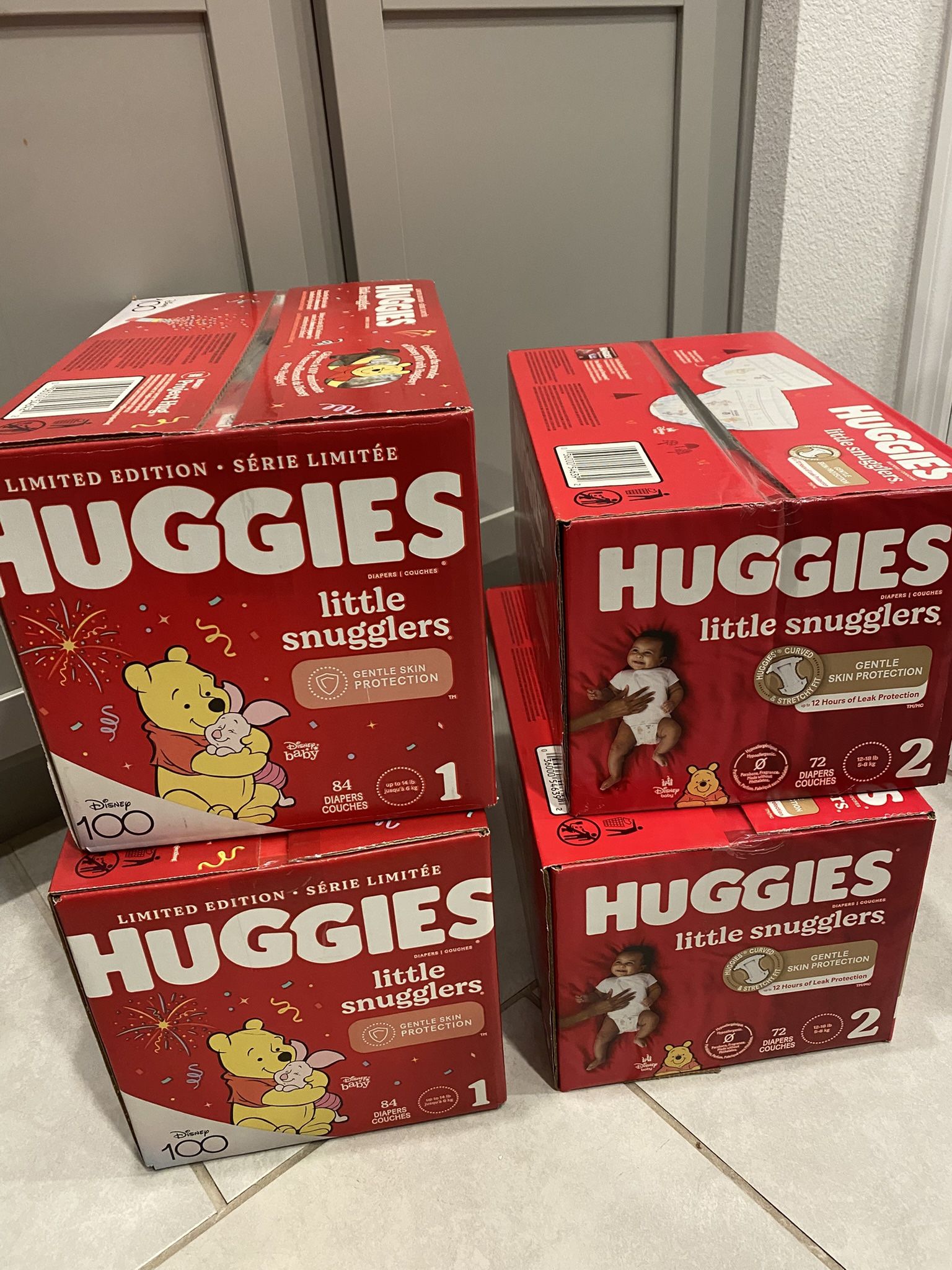 Brand new Huggies snugglers diapers 2 boxes size 1 and 2 boxes size 2