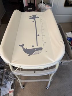 Baby changing table and bathtub