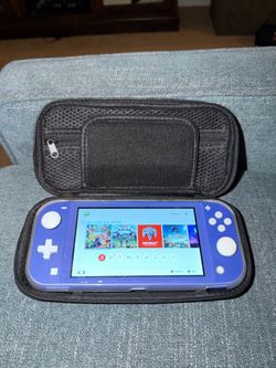 Nintendo Switch Lite + Case + Games