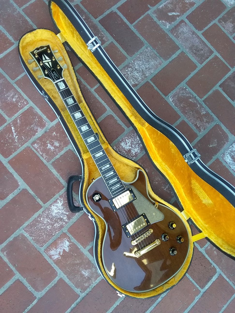 1976 Orlando Les Paul Custom electric guitar with original hard case and receipt from 1976 made in Japan