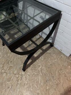 Glass and black metal end table