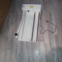 Shrink wrapping machine.