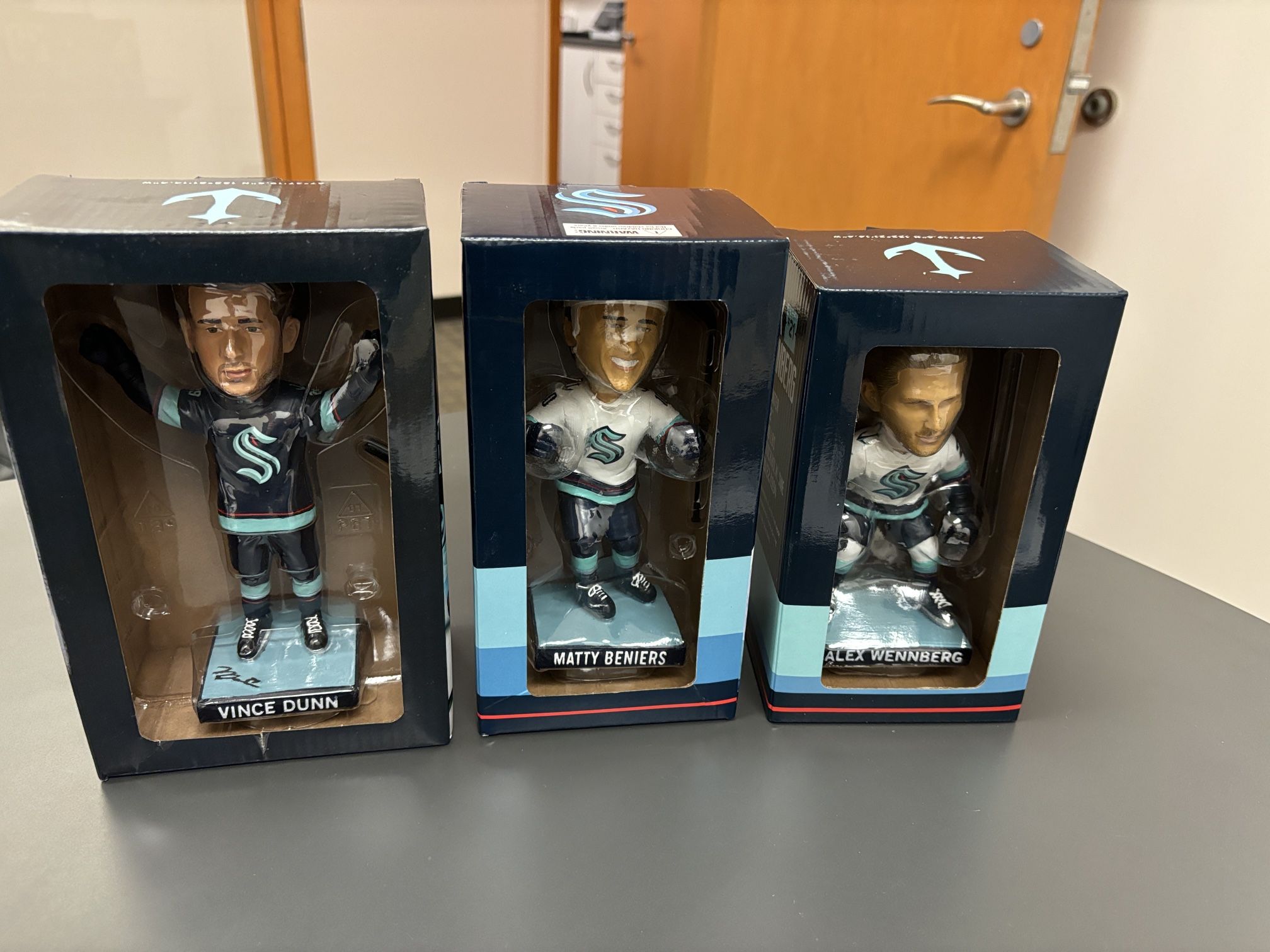 Kraken Bobble heads Marty Beniers, Vince Dunn, Alex Webber’s