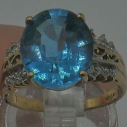 10KT YELLOW GOLD FASHION RING WITH DIAMONDS AND BLUE STONE 3.9GR SIZE 6.75. 848960-1.