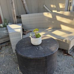 Rattan patio sofa and side table