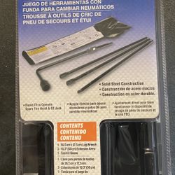 Tire, Wrench And Floor Jack