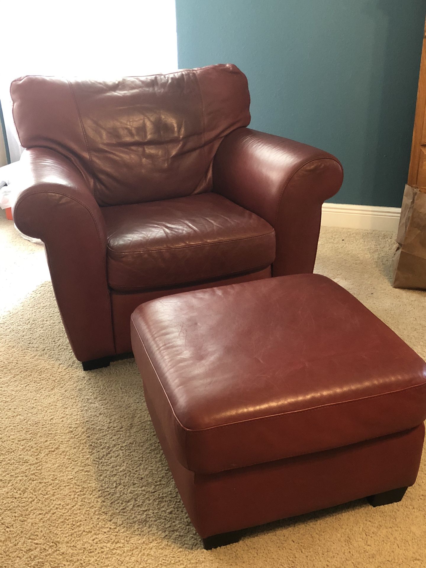 Natuzzi distressed leather chair and ottoman.