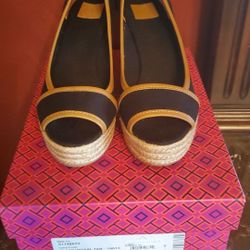 Brand new Tory Burch black royal tan wedges in size 8.5