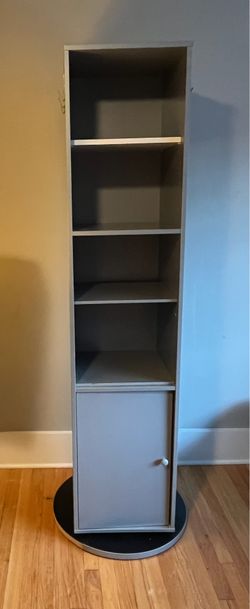 Rotating storage tower with mirror/wardrobe