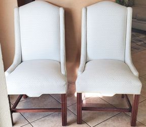 Two heavy uphoslsted dining chairs