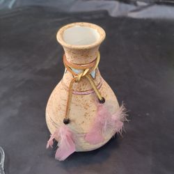 small, hand-painted ceramic vase 