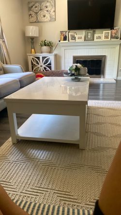 White coffee table with draws .
