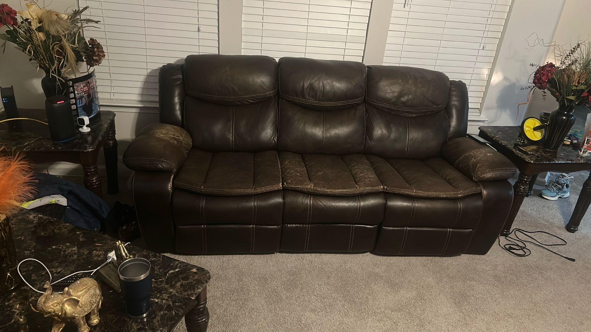 2pc Brown leather Reclining Sofa w/charging port. Includes Decor Rug and End Tables
