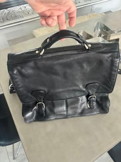 Kenneth Cole Leather laptop briefcase in black.  High-quality leather with fabric lining and silver hardware.$50
