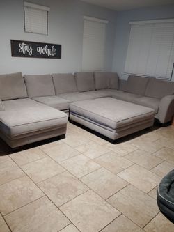 Very large sectional and ottoman with Chase from living spaces