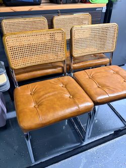 Rattan faux leather dining chairs