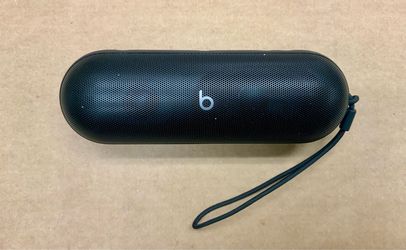 Beats by Dre pill Bluetooth wireless speaker black color USB-C charger audio sound music podcast content creator handheld portable rugged outdoors ent
