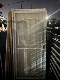 Metal door with frame  Width 36 inches Height 80 inches standard size Like new 