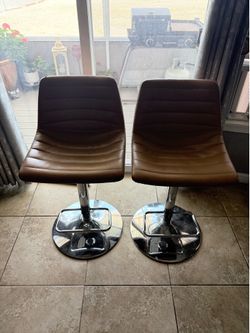 Two adjustable barstools $30