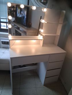 White vanity likes up , has all drawers really pretty