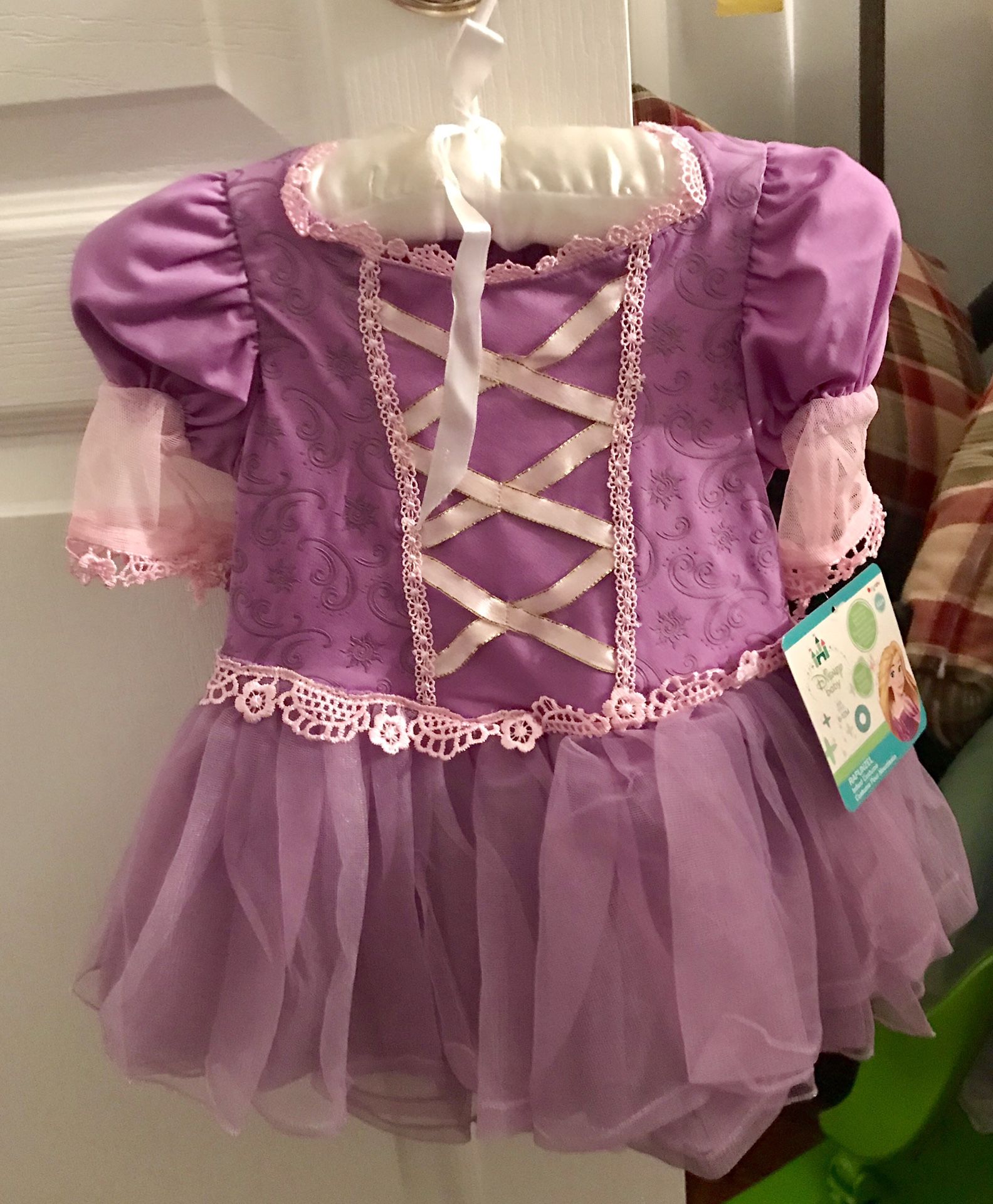 NEW with tag, RAPUNZEL dress w/headband & snap closure crotch for diaper change. Size 6M+