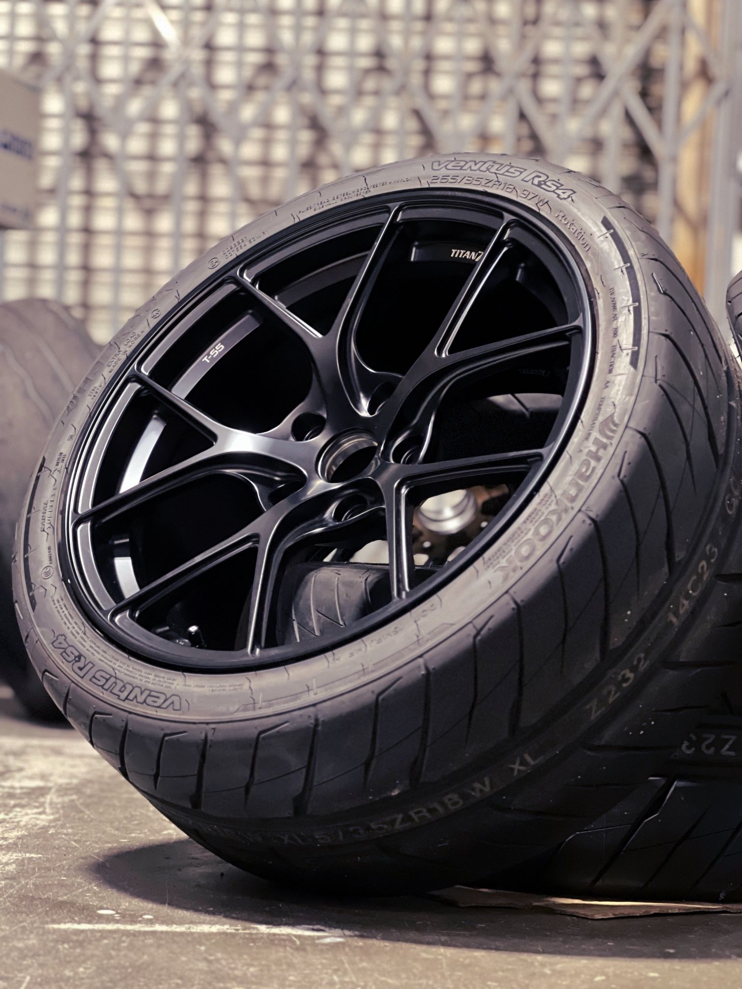 Brand New Titan 7 T-S5 18x9.5 +45 5x120 64.1HB with 265/35/18 Hankook RS4