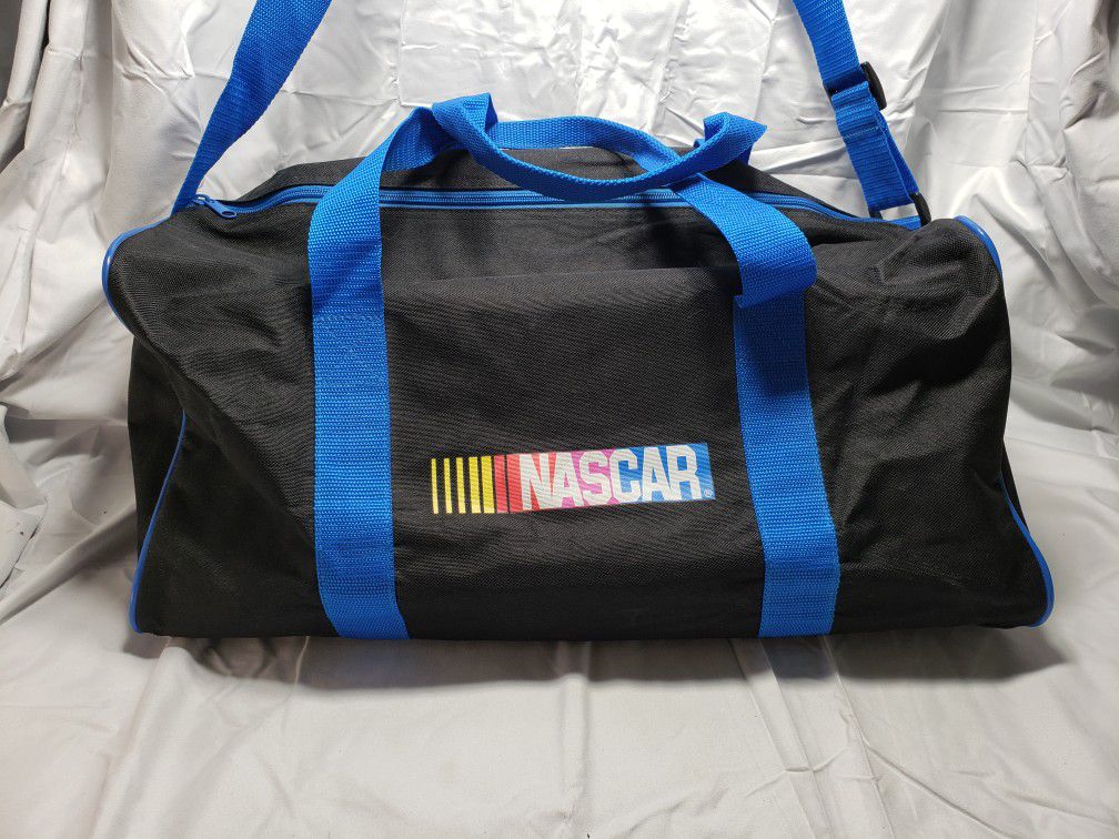Nascar black and blue durable duffle bag. Duffle bag has handles on top or you can use the padded  shoulder strap. Duffle bag is preowned in good cond