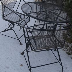wrought iron table and chairs 