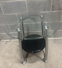 26-H26 Round Glass, Chrome, and Black Side Table  50$cash