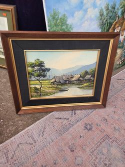 The framed oil painting appears to be a mid-20th-century decorative artwork.