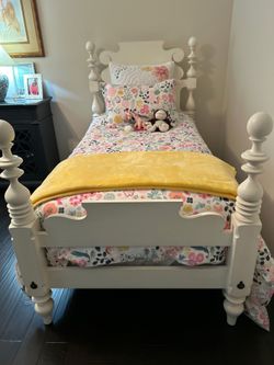 Two White Wood Beds