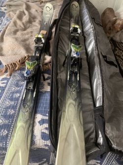 Women’s Downhill Ski’s And Ski Bag Carrier