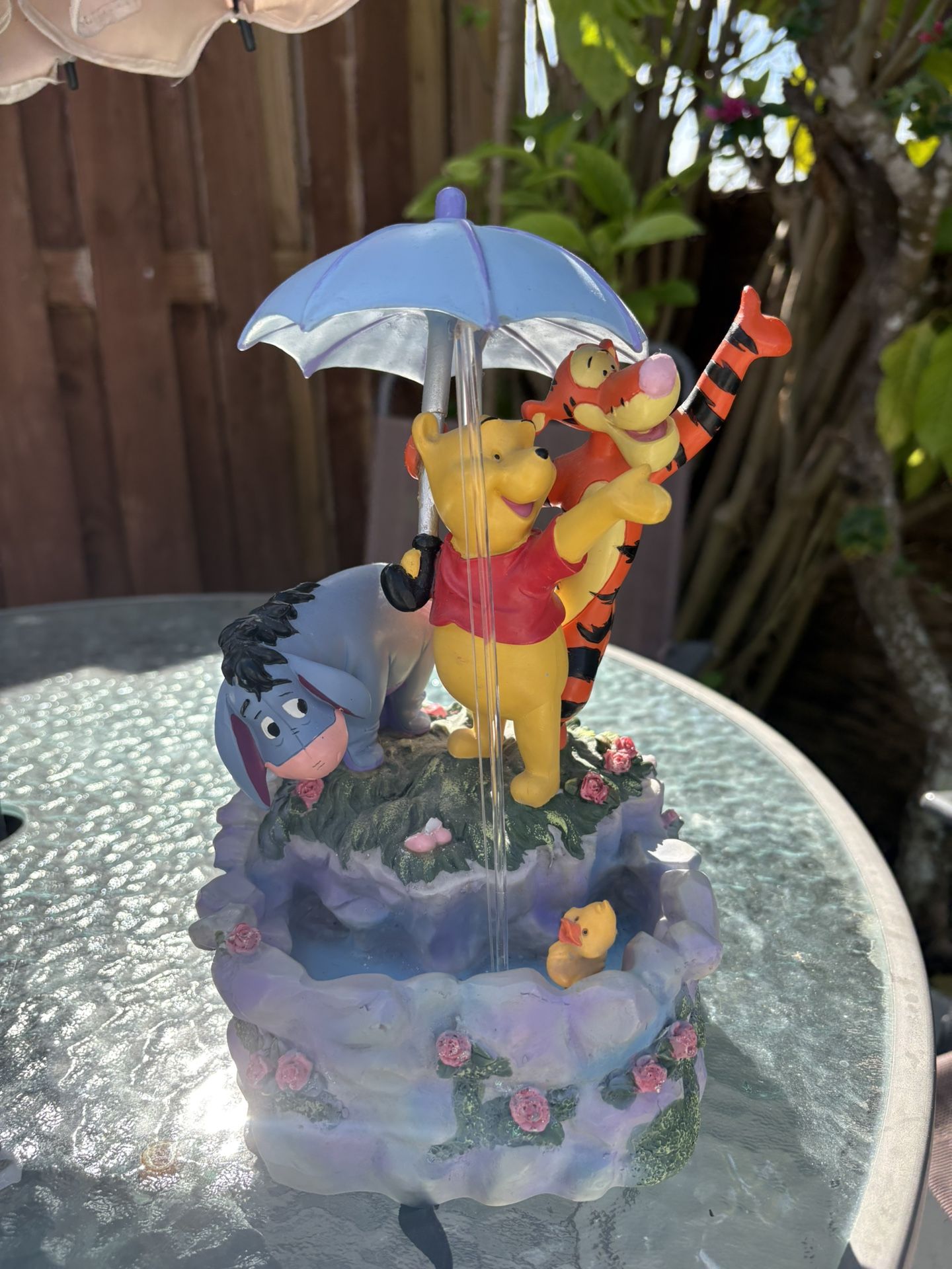 This is a Disney Winnie the Pooh and Friends musical water fountain