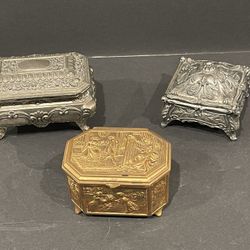 Trio of carved metal trinket boxes. 