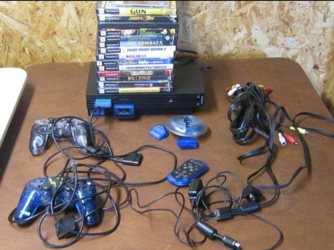 $75.00 PS2 Controller, Remote, 15 Games, Cord, and More