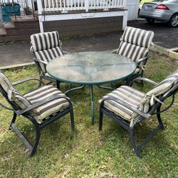 Outdoor Patio Set For Sale. Metal Chairs, Glass Table, and Cushions  