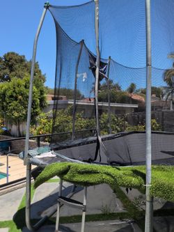 Trampoline with net and hoop , ladder