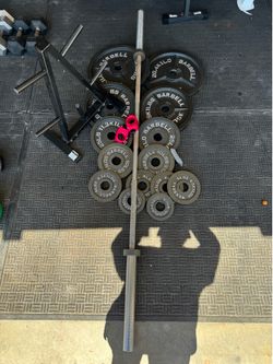 Olympic weights 255lbs total plus 7ft 45lbs bar and weights tree