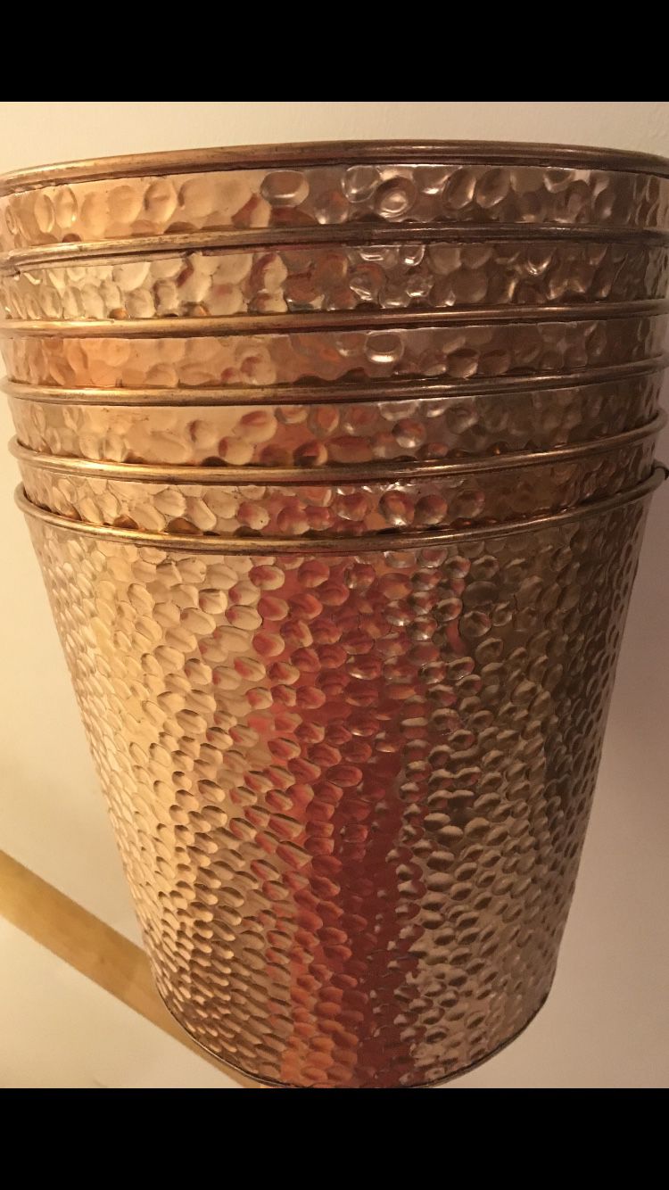Six pounded copper pots