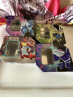 Set Of Four Pokémon Trading Card Game Tin Boxes.